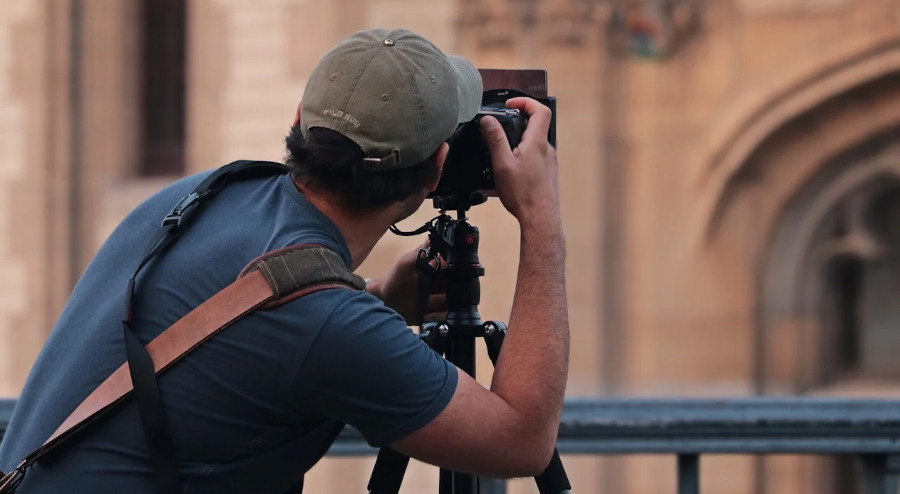 a man wearing a cap showing the concept of Architectural Photography 